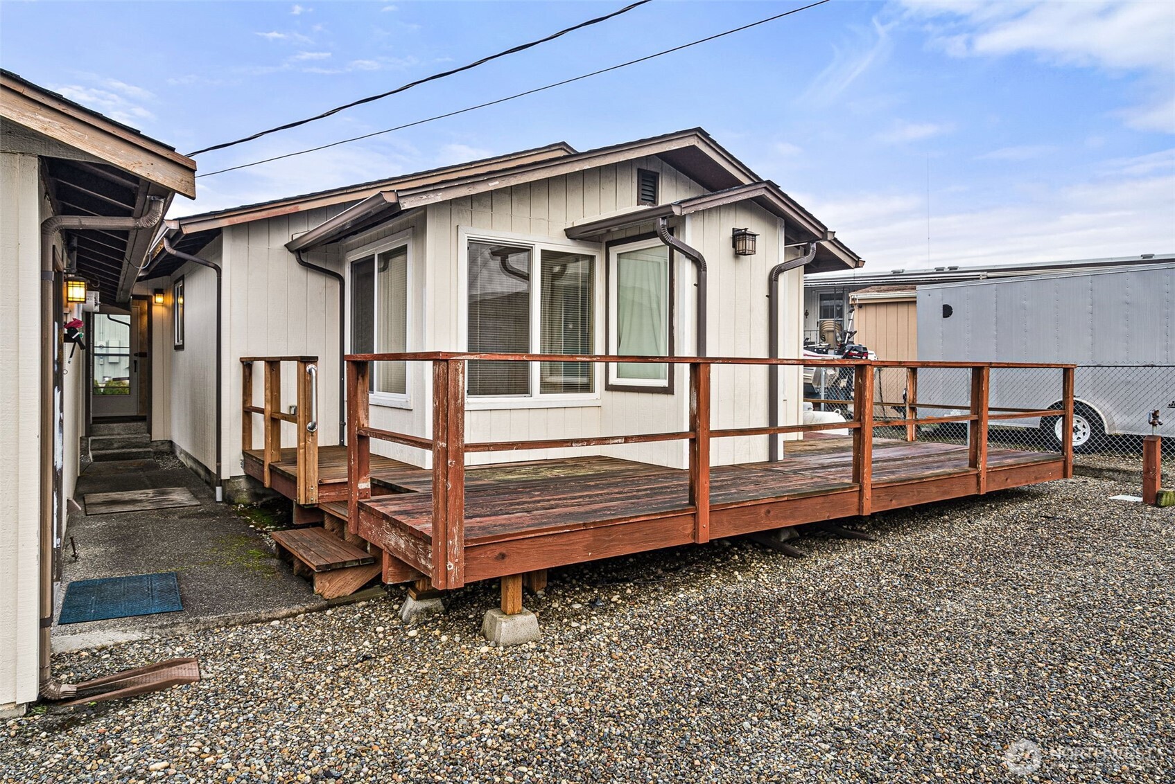 9101 Steilacoom Road Southeast, Unit 93 Olympia, WA 98513 - Photo 21 of 40 a view of a small house with wooden fence