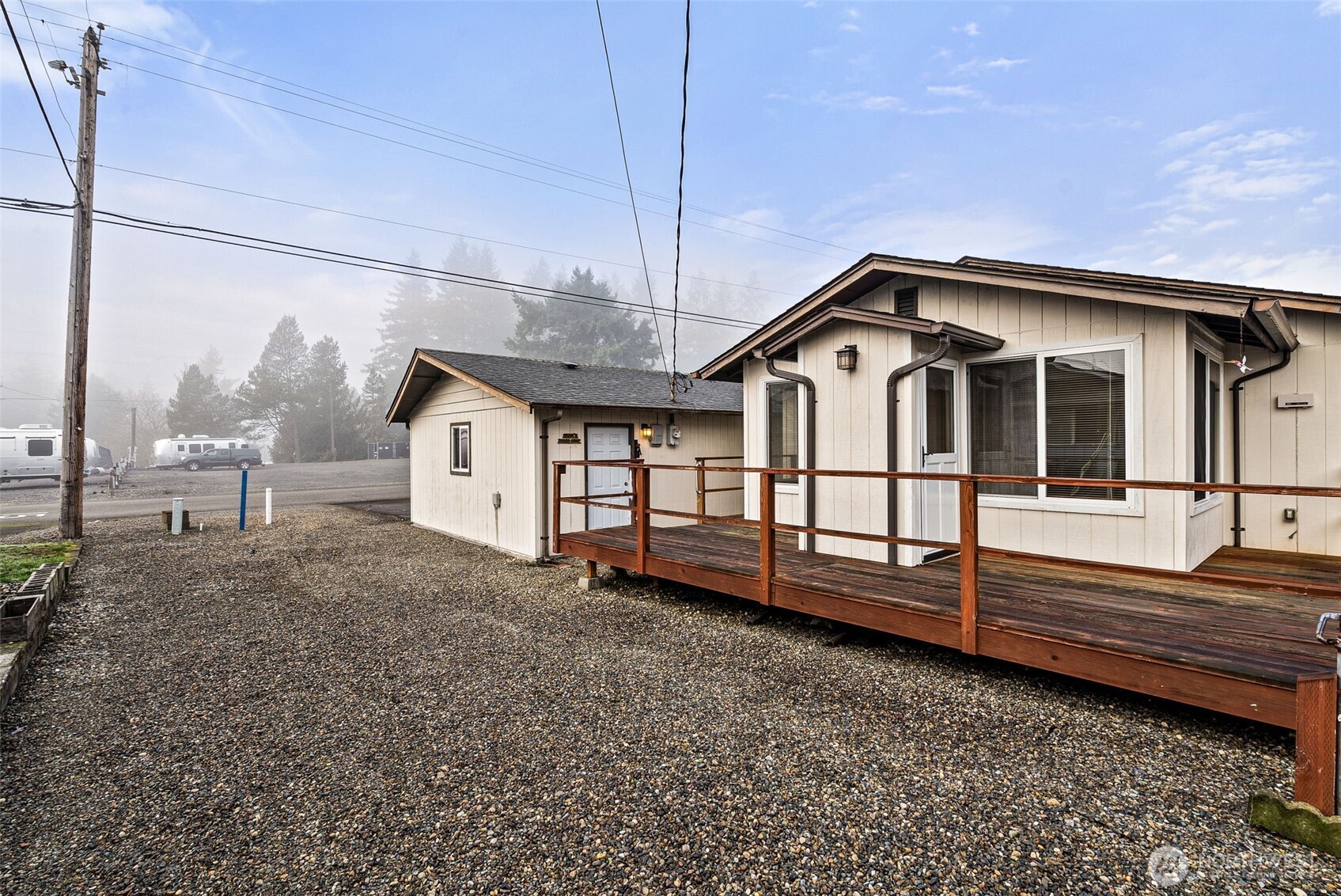 9101 Steilacoom Road Southeast, Unit 93 Olympia, WA 98513 - Photo 22 of 40 a view of a house with a small yard and wooden fence