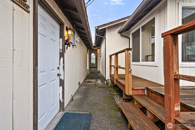 a view of a livingroom with wooden floor and door