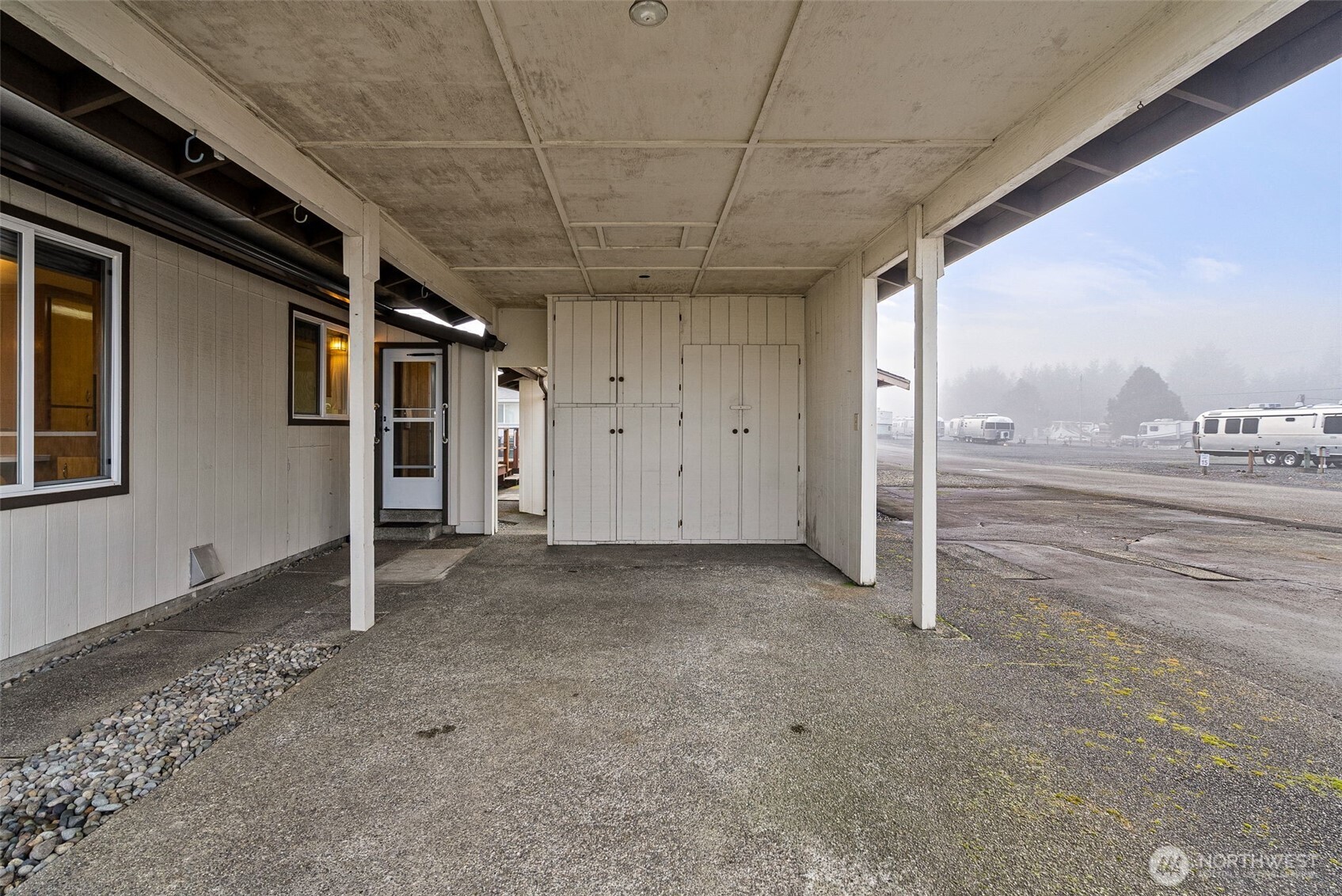 9101 Steilacoom Road Southeast, Unit 93 Olympia, WA 98513 - Photo 26 of 40 a view of a livingroom with wooden floor and door