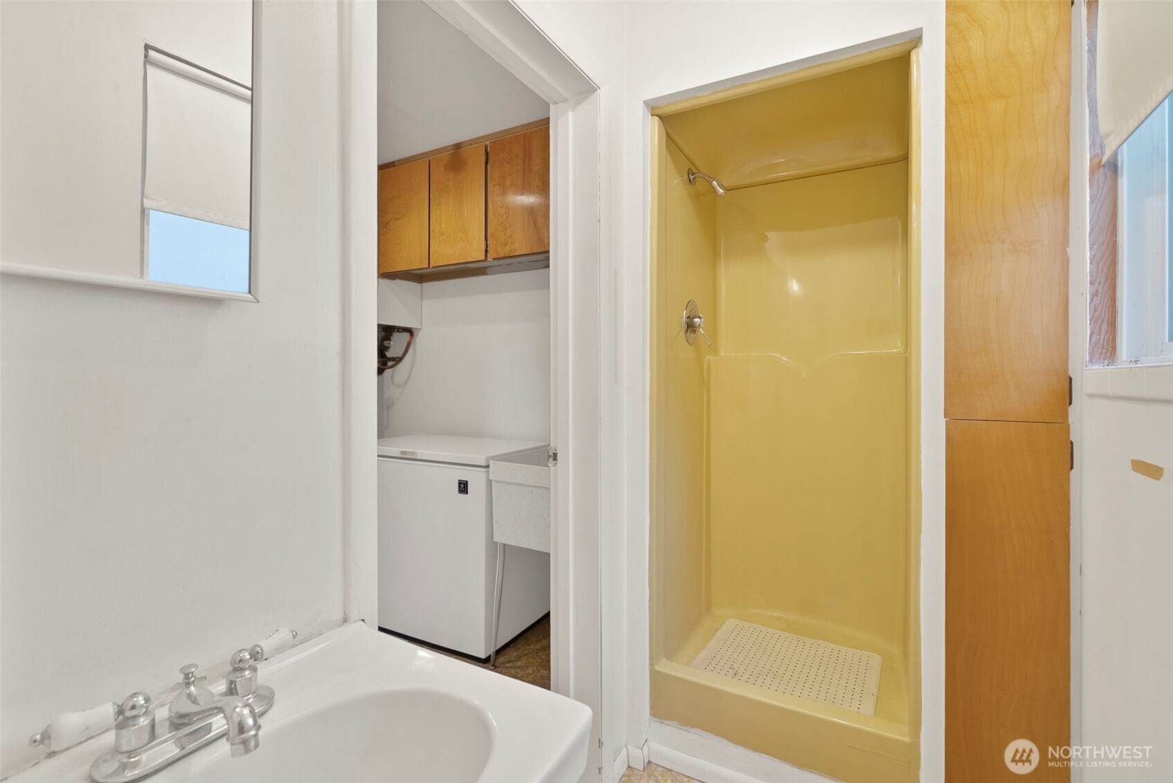9101 Steilacoom Road Southeast, Unit 93 Olympia, WA 98513 - Photo 31 of 40 a bathroom with a sink and a mirror