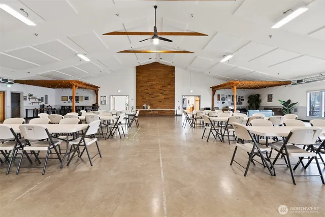 a room with lots of lots of white furniture and windows