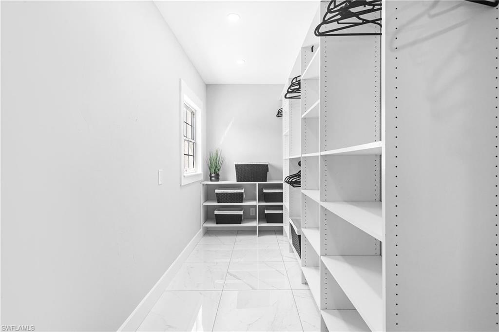 1330 Rock Road Naples, FL 34120 - Photo 26 of 37 Walk in closet with marble finish floor