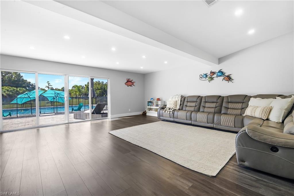 1330 Rock Road Naples, FL 34120 - Photo 10 of 37 Living room featuring recessed lighting, dark wood finished floors, and baseboards