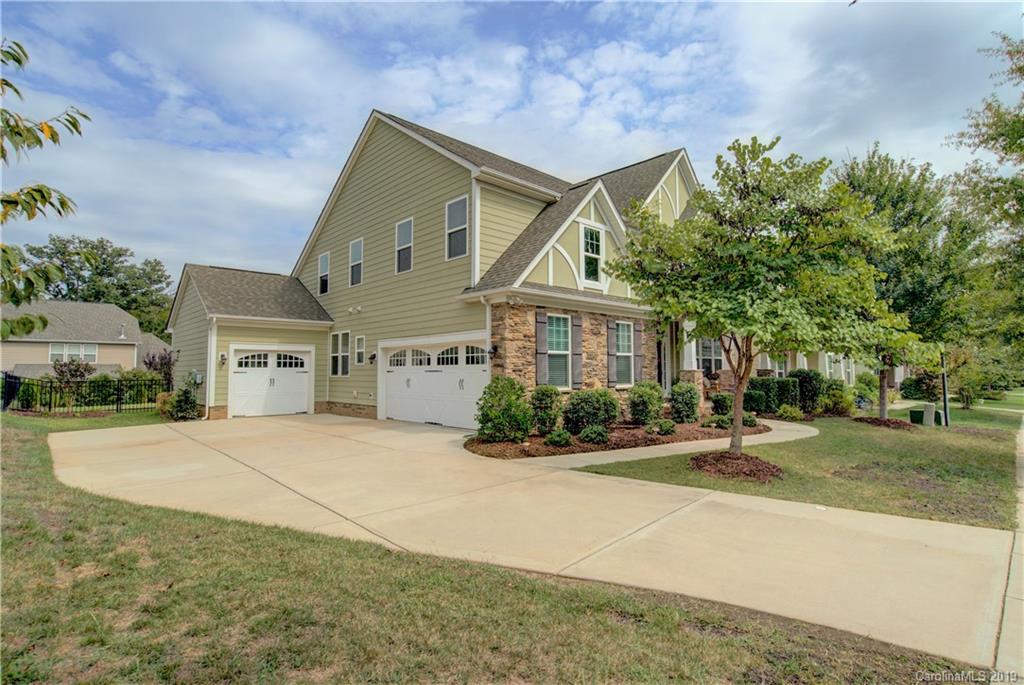 1633 Ridgehaven Road Waxhaw, NC 28173 - Photo 2 of 48 a front view of a house with a yard and potted plants