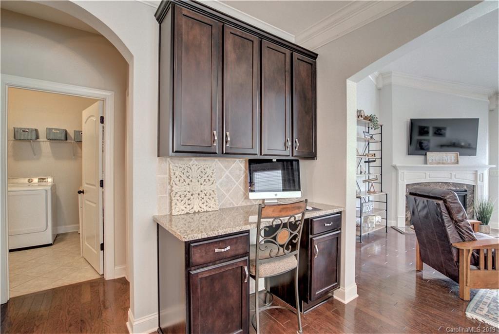 1633 Ridgehaven Road Waxhaw, NC 28173 - Photo 13 of 48 a kitchen with a refrigerator and a stove top oven