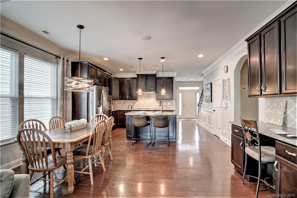 1633 Ridgehaven Road Waxhaw, NC 28173 - Photo 14 of 48 a view of a dining room with furniture window and wooden floor