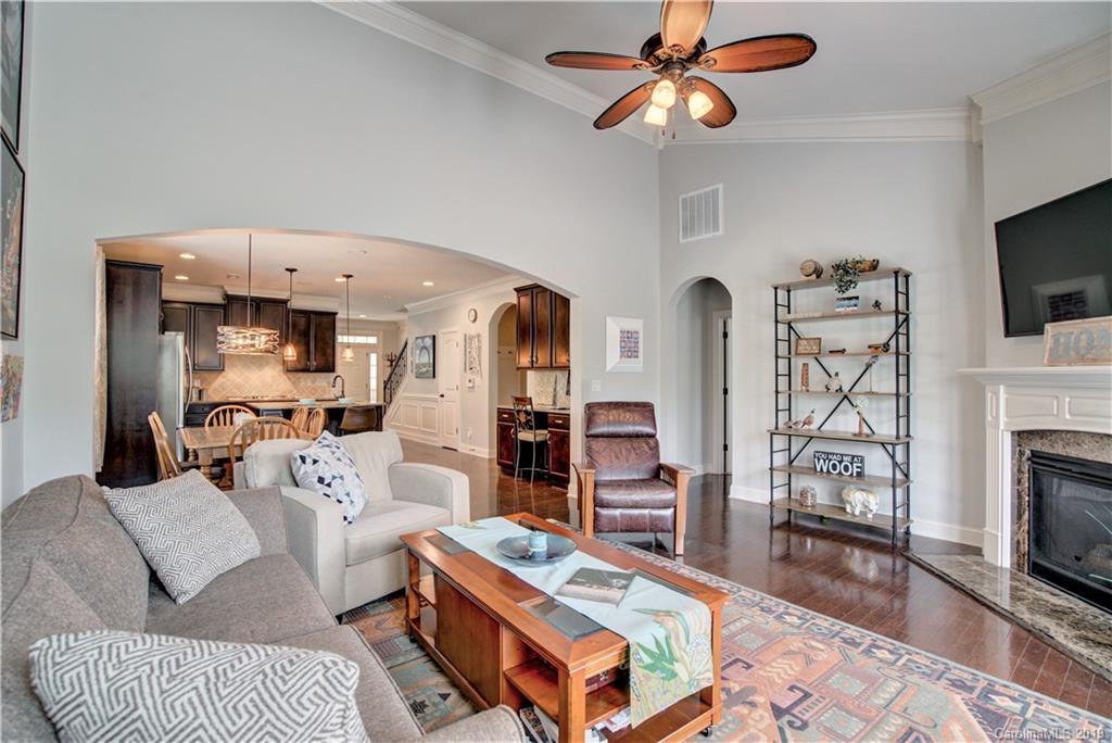 1633 Ridgehaven Road Waxhaw, NC 28173 - Photo 16 of 48 a living room with furniture a fireplace and a flat screen tv