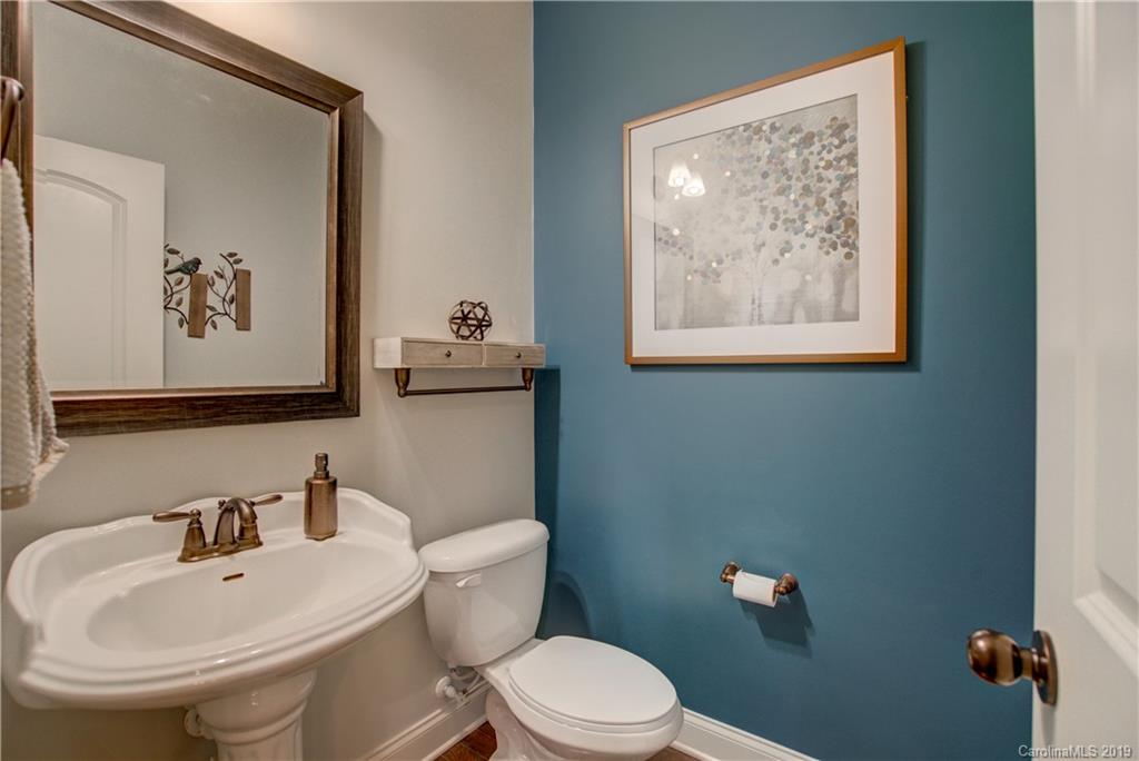 1633 Ridgehaven Road Waxhaw, NC 28173 - Photo 18 of 48 a bathroom with a toilet sink and mirror
