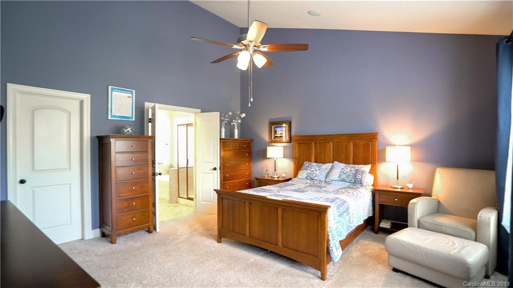 1633 Ridgehaven Road Waxhaw, NC 28173 - Photo 21 of 48 a bedroom with a bed couch and a window