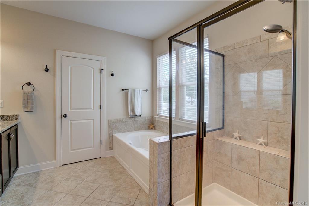 1633 Ridgehaven Road Waxhaw, NC 28173 - Photo 23 of 48 a bathroom with a tub shower and sink