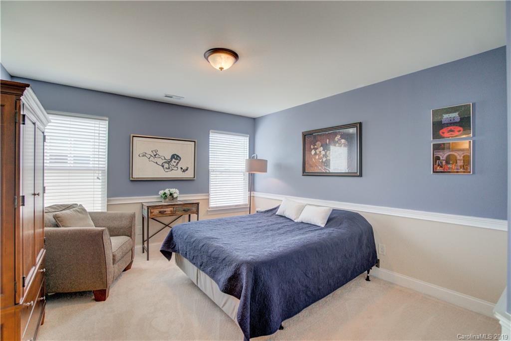 1633 Ridgehaven Road Waxhaw, NC 28173 - Photo 25 of 48 a bedroom with a bed and a couch