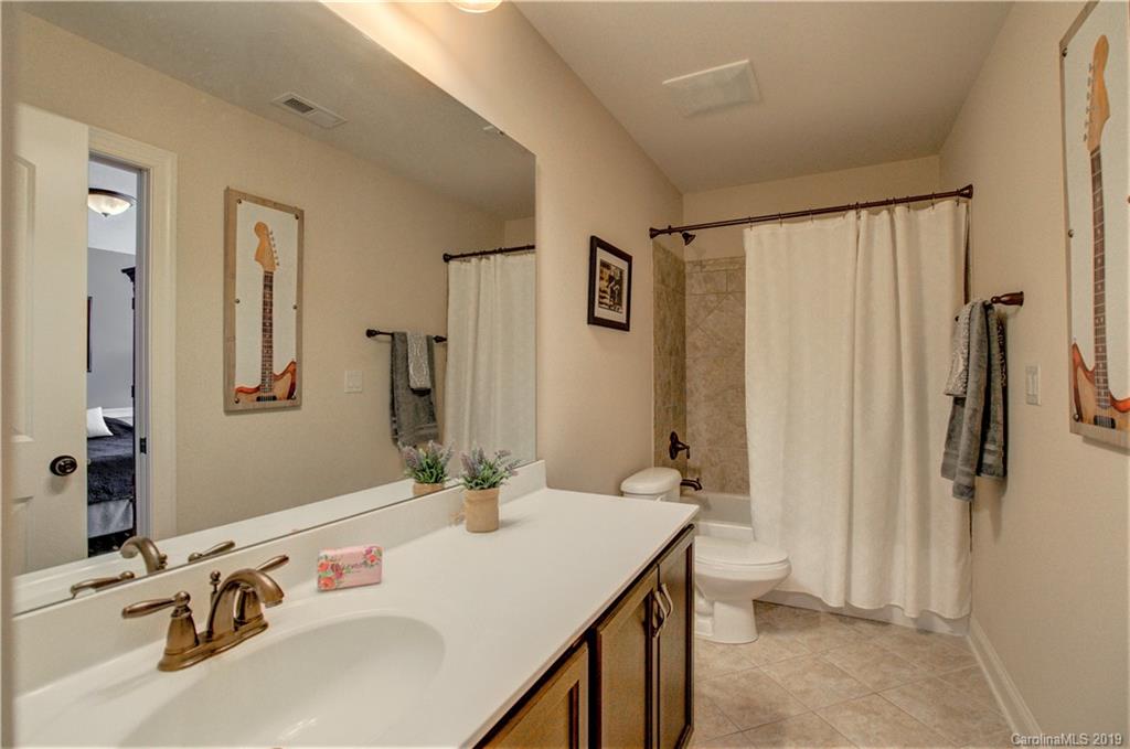 1633 Ridgehaven Road Waxhaw, NC 28173 - Photo 26 of 48 a bathroom with a sink and a mirror