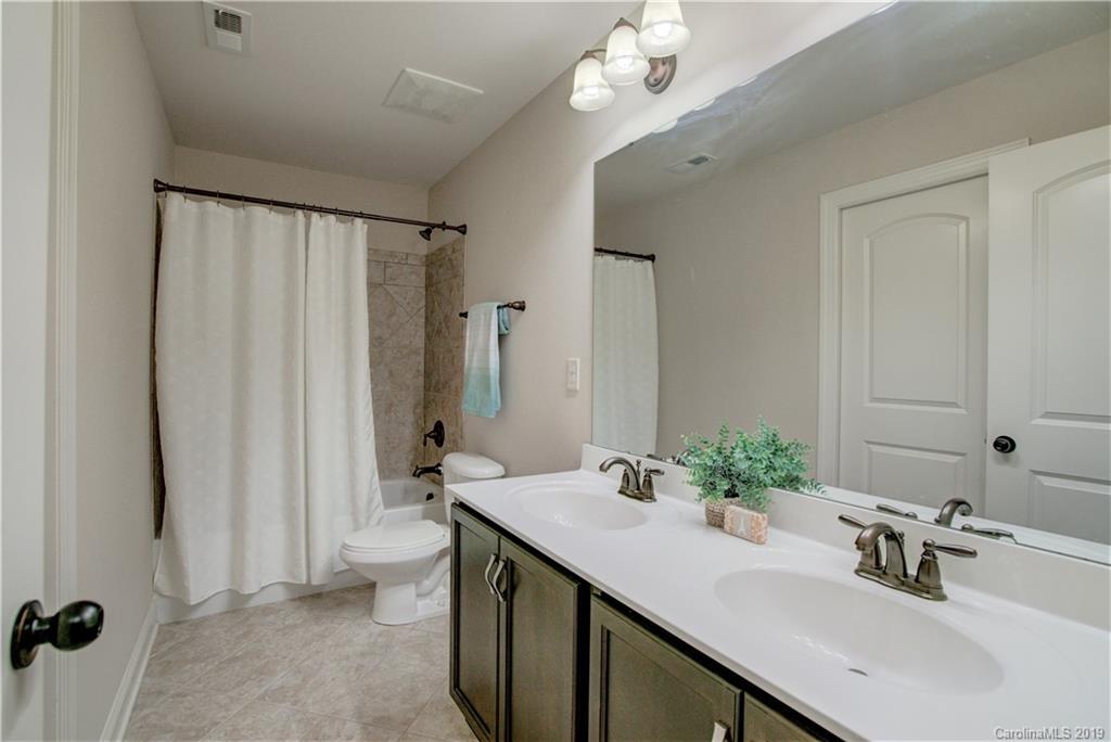 1633 Ridgehaven Road Waxhaw, NC 28173 - Photo 29 of 48 a bathroom with a sink double vanity and a mirror