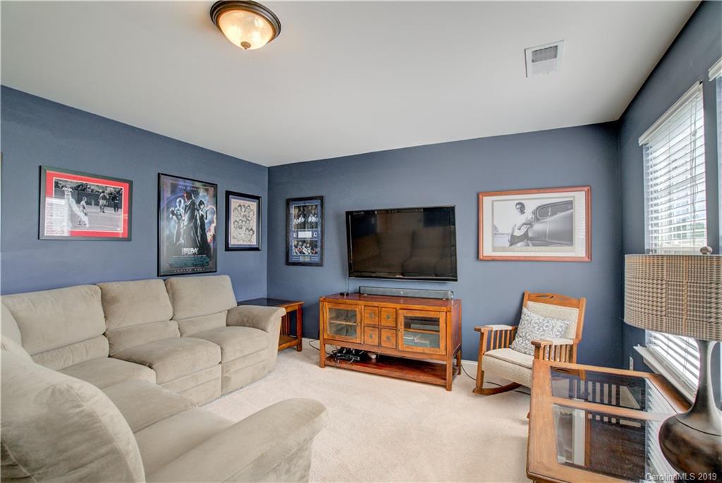 1633 Ridgehaven Road Waxhaw, NC 28173 - Photo 30 of 48 a living room with furniture and a flat screen tv