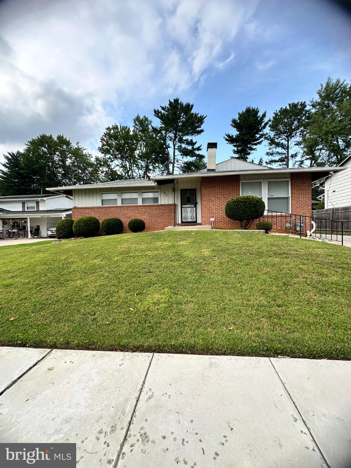 8336 Scotts Level Road Baltimore, MD 21208 - Photo 5 of 55 Charming brick home with lush lawn.