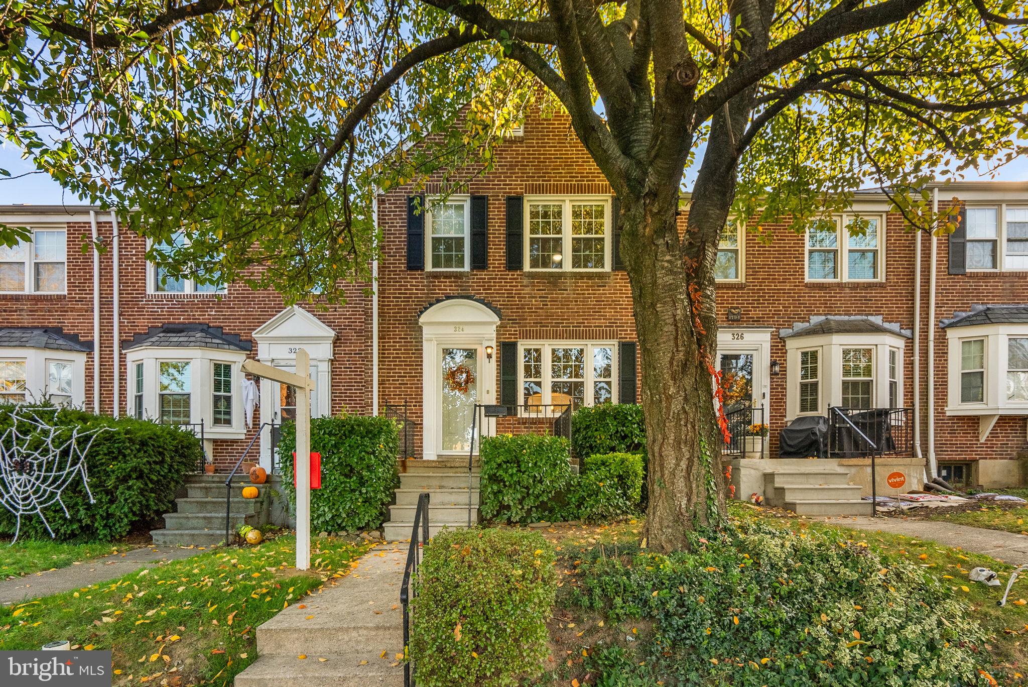 324 Stanmore Road Baltimore, MD 21212 - Photo 1 of 40 a front view of a house with a garden