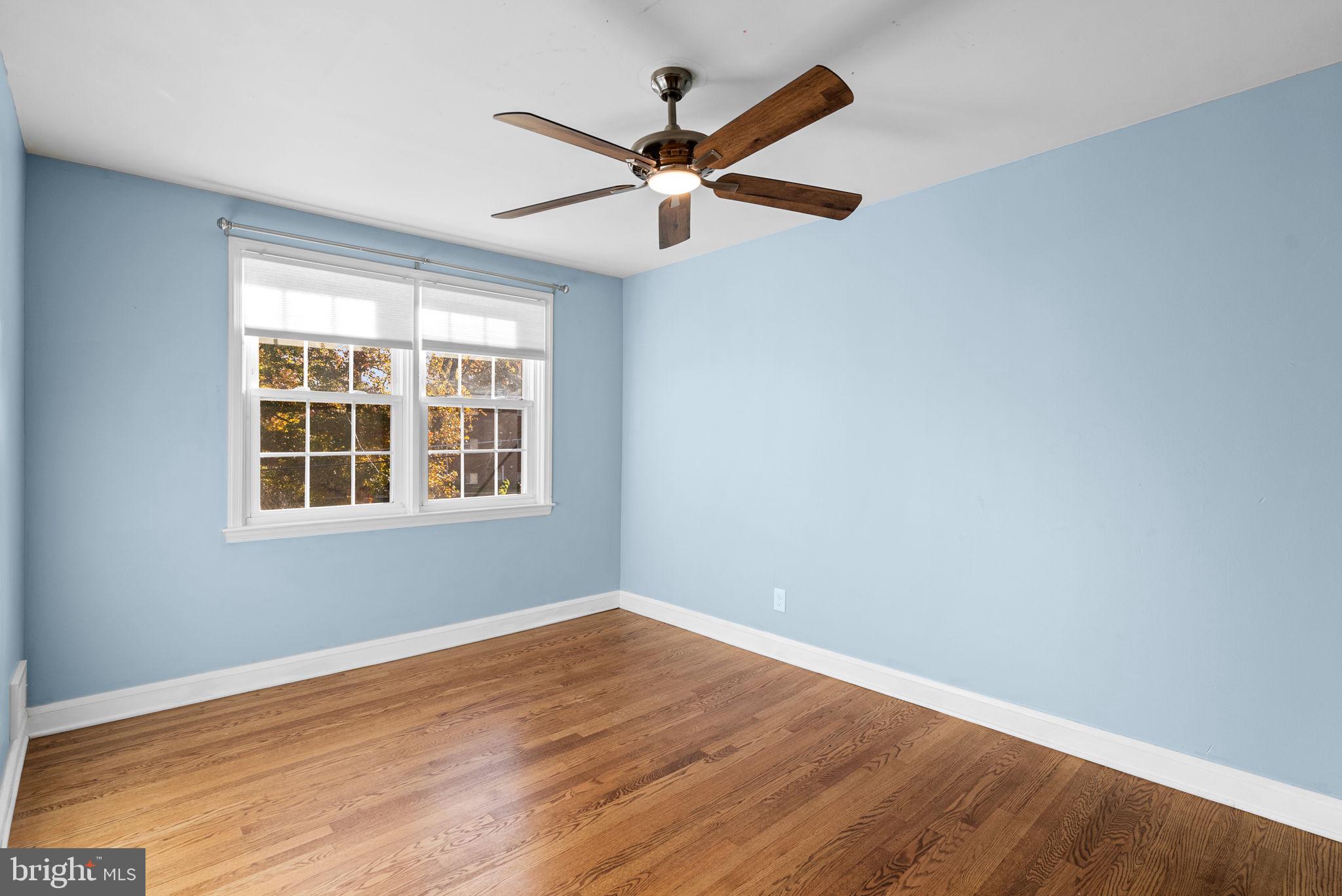 324 Stanmore Road Baltimore, MD 21212 - Photo 17 of 40 a view of a big room with wooden floor and windows