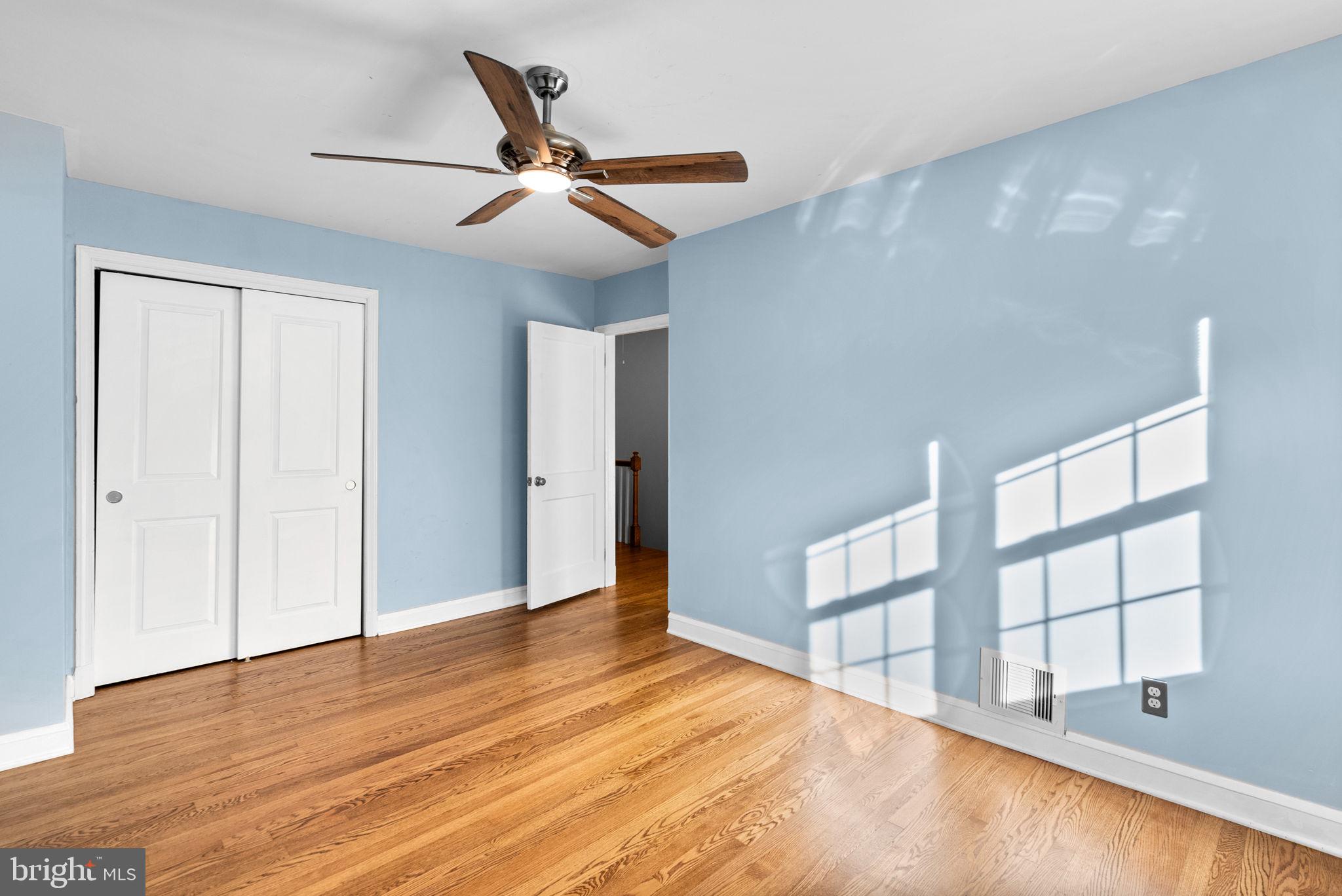 324 Stanmore Road Baltimore, MD 21212 - Photo 18 of 40 a view of an empty room with wooden floor and a window