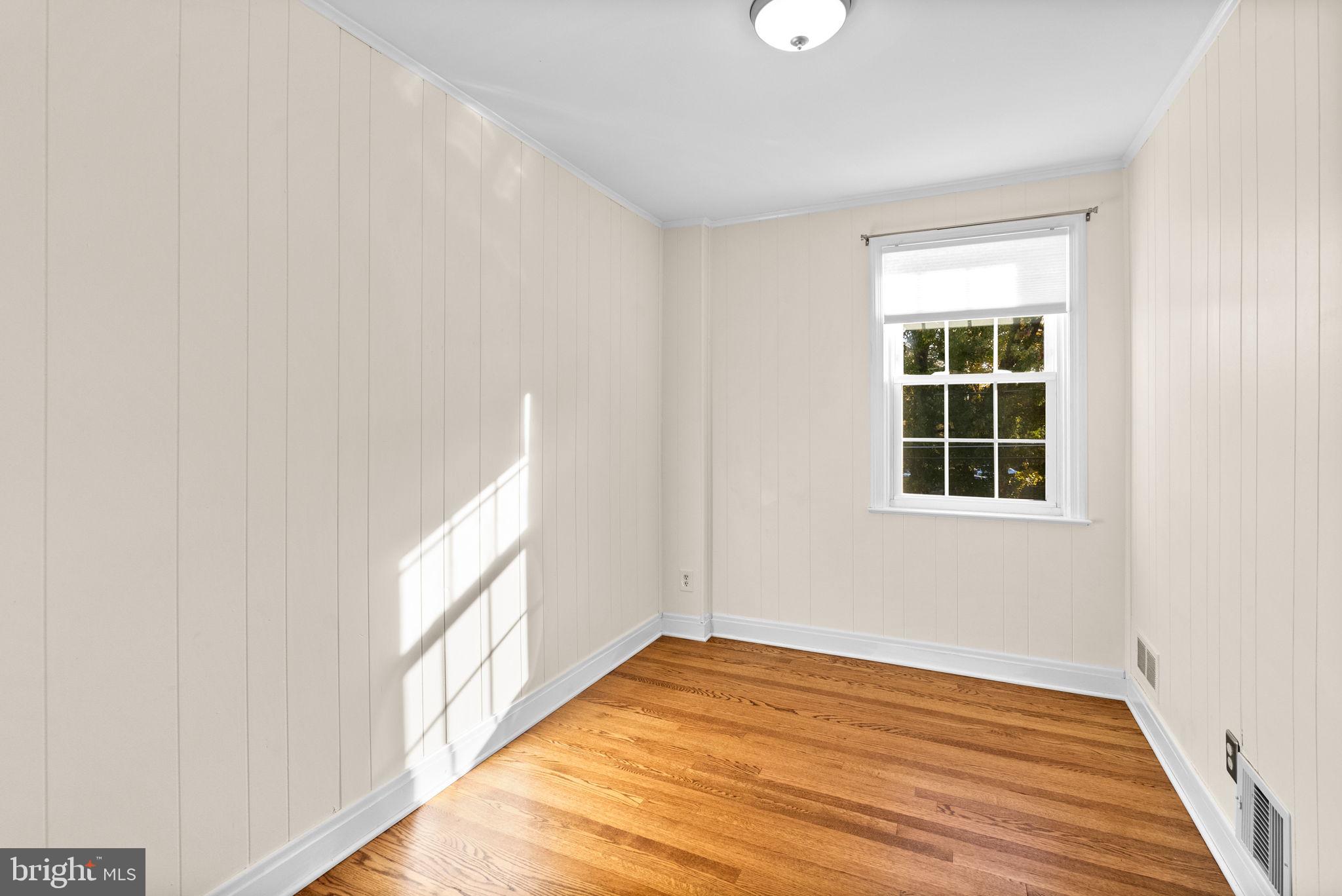 324 Stanmore Road Baltimore, MD 21212 - Photo 19 of 40 a view of empty room with wooden floor and fan