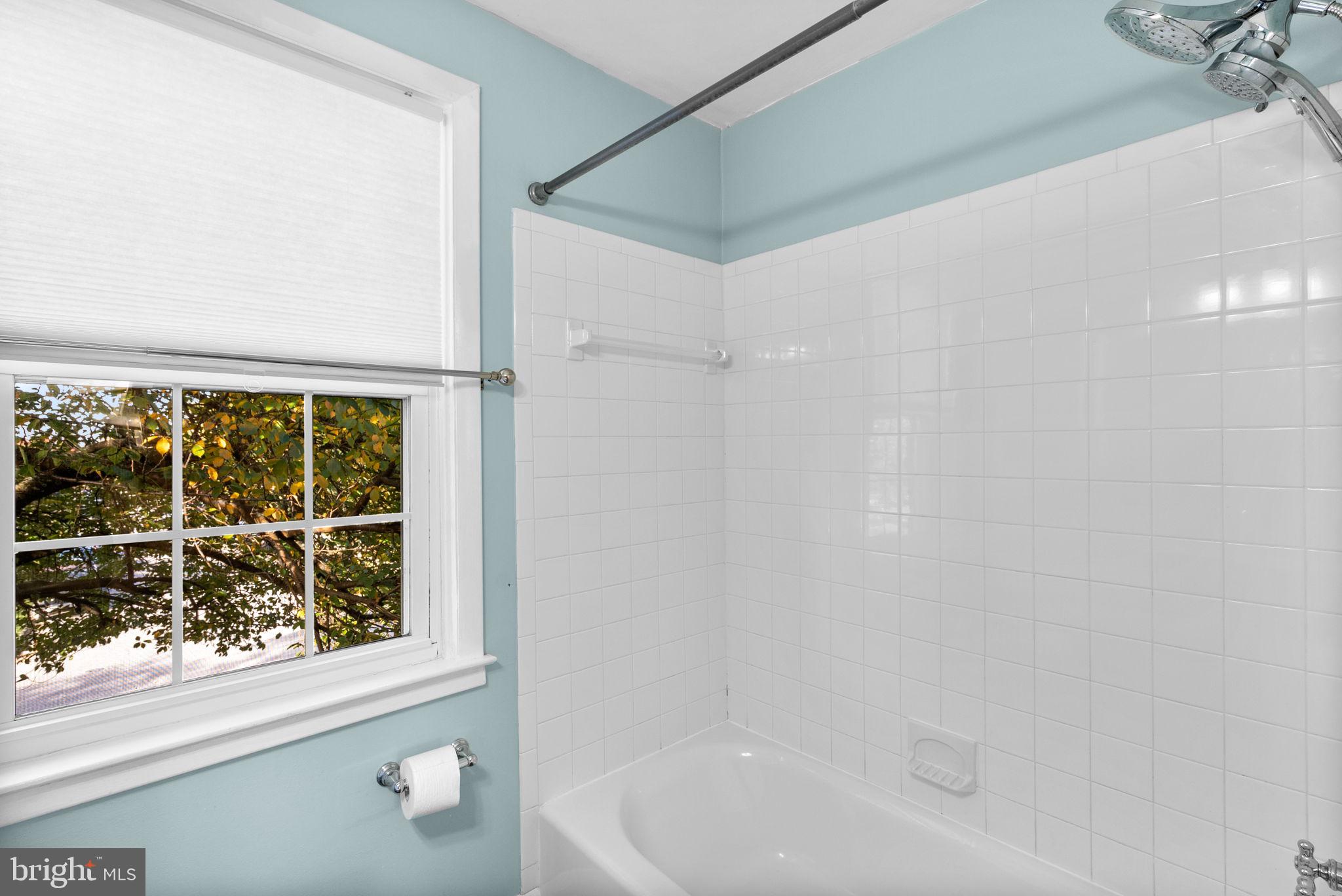 324 Stanmore Road Baltimore, MD 21212 - Photo 22 of 40 a bathroom with a bathtub and a shower