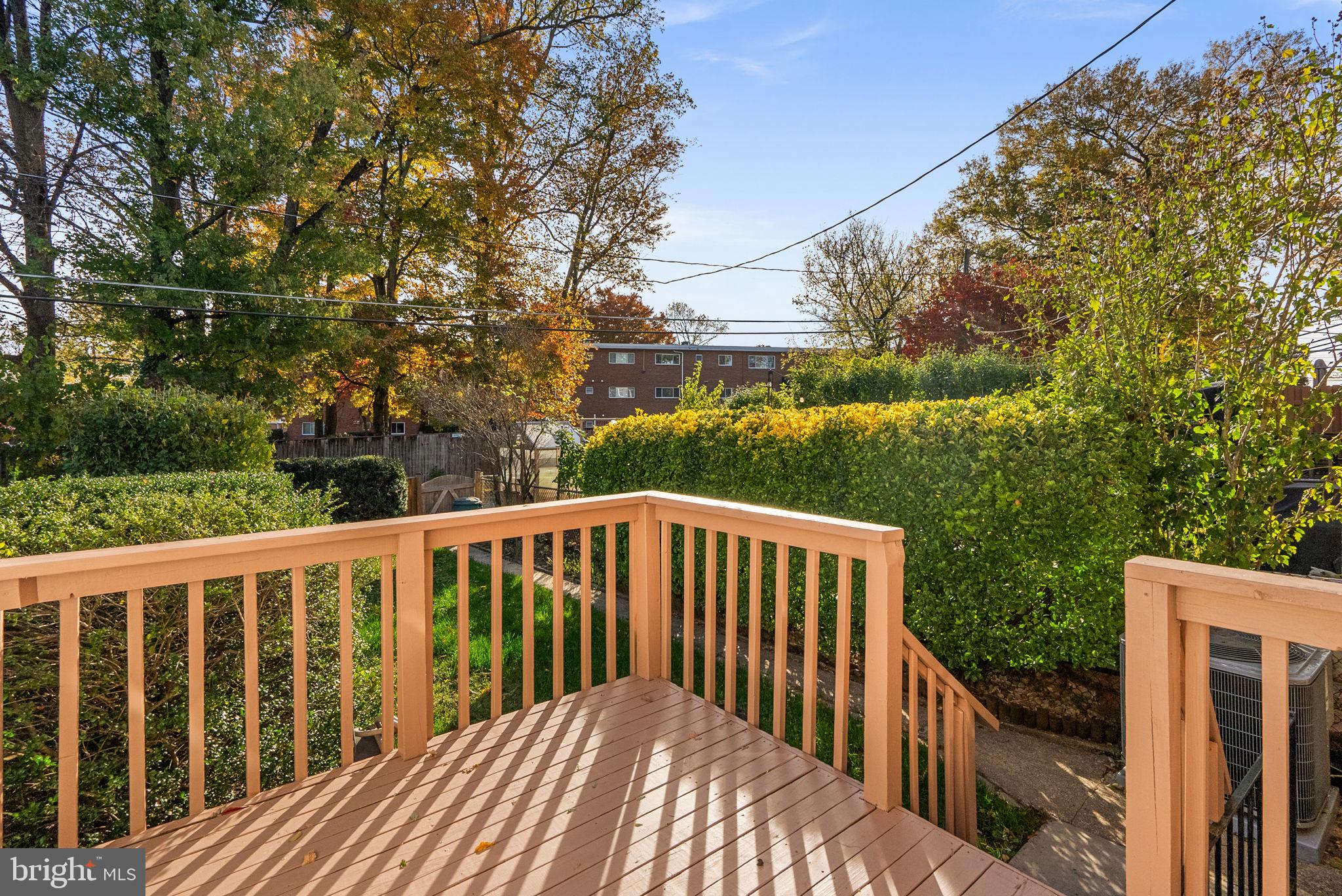324 Stanmore Road Baltimore, MD 21212 - Photo 28 of 40 a balcony with wooden floor and fence