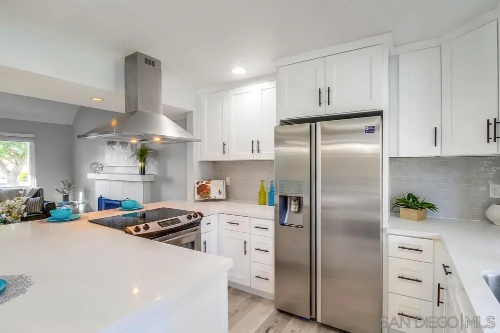 515 Bluffview Road Spring Valley, CA 91977 - Photo 14 of 41 a kitchen with stainless steel appliances a refrigerator sink and stove