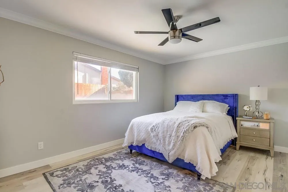 515 Bluffview Road Spring Valley, CA 91977 - Photo 19 of 41 a bedroom with a bed and a ceiling fan