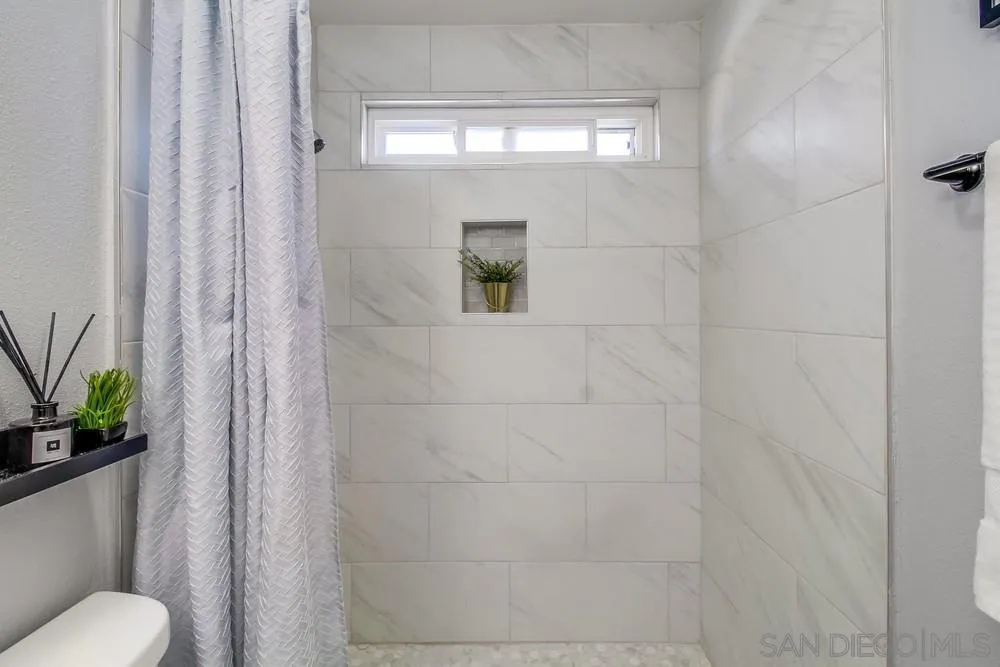 515 Bluffview Road Spring Valley, CA 91977 - Photo 23 of 41 a bathroom with a toilet and a shower