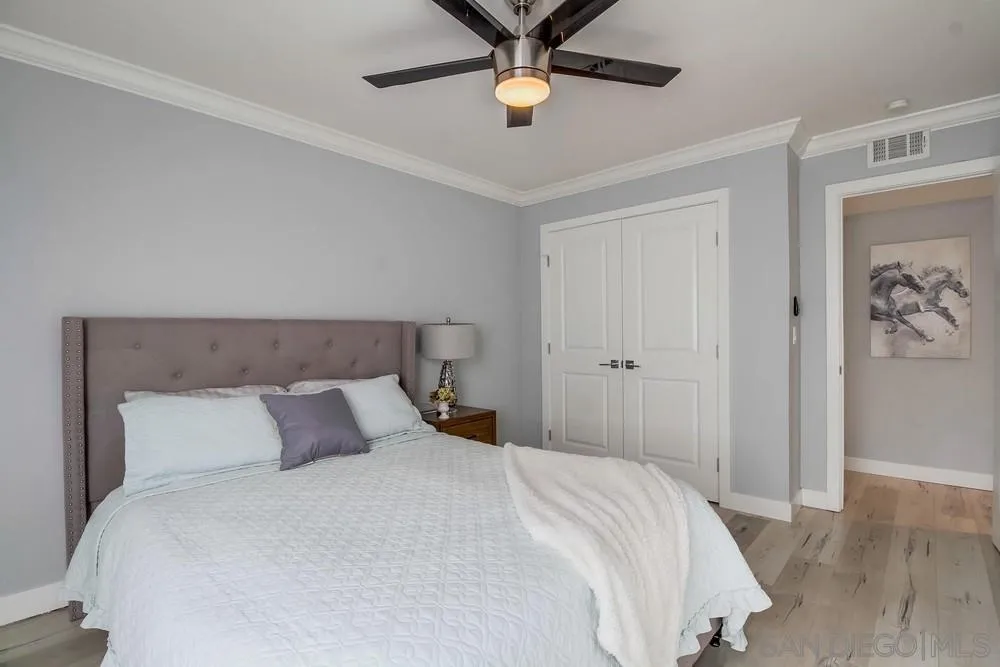 515 Bluffview Road Spring Valley, CA 91977 - Photo 25 of 41 a bedroom with a bed and a chandelier