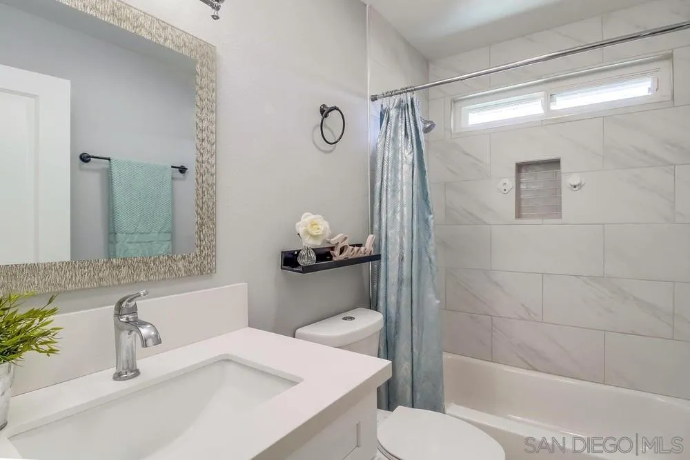 515 Bluffview Road Spring Valley, CA 91977 - Photo 28 of 41 a bathroom with a sink toilet and shower