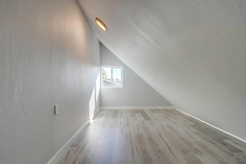 515 Bluffview Road Spring Valley, CA 91977 - Photo 31 of 41 a view of an empty room and wooden floor