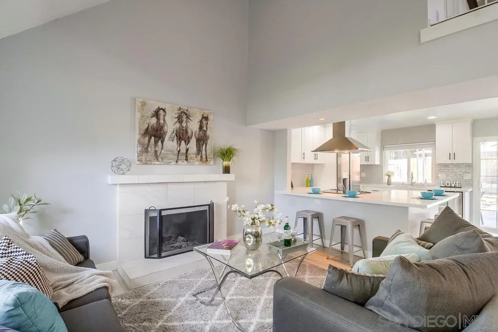 515 Bluffview Road Spring Valley, CA 91977 - Photo 6 of 41 a living room with furniture and a fireplace