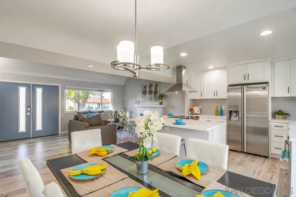 515 Bluffview Road Spring Valley, CA 91977 - Photo 10 of 41 a kitchen with stainless steel appliances granite countertop a refrigerator dining table and chairs
