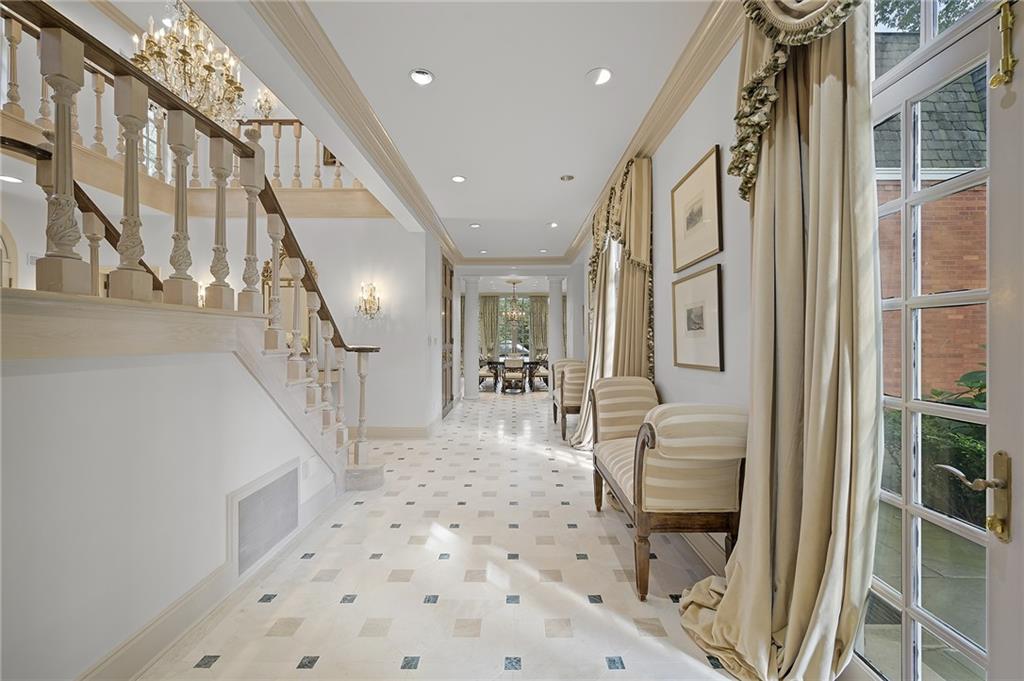898 Persimmon Road Sewickley, PA 15143 - Photo 8 of 50 French limestone floors with marble inlays lead you into light-filled, main living spaces made for entertaining.