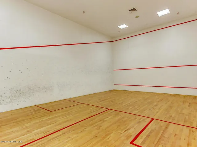 a view of roof deck with chairs and wooden floor