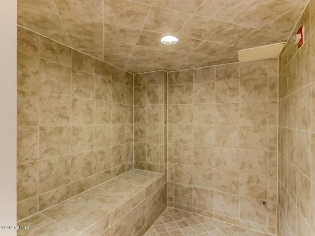 a view of a livingroom with furniture and a potted plant