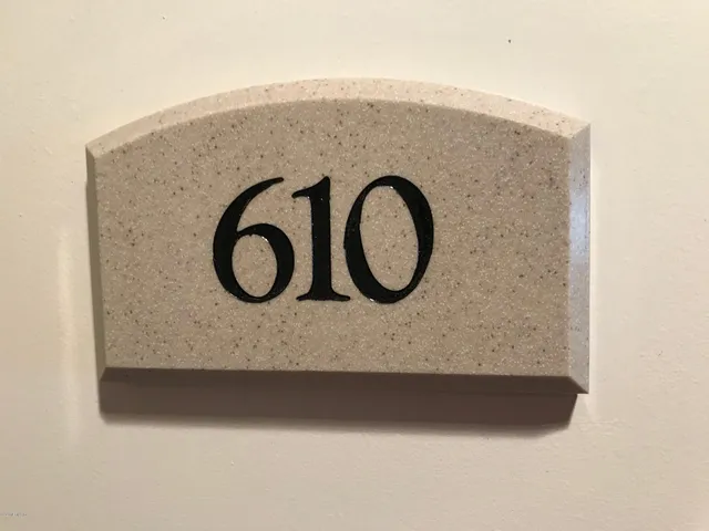 a bathroom with a toilet and a washing machine