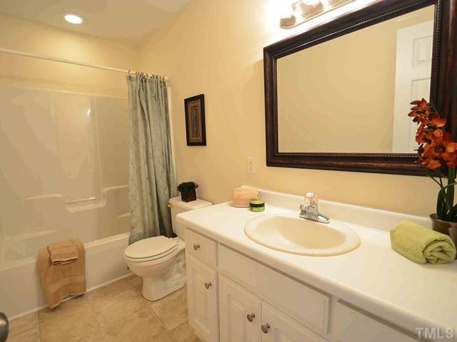 5660 Zacks Mill Road Angier, NC 27501 - Photo 15 of 24 View of the 2nd bathroom with new paint, new flooring, new mirror! Wow! Bathroom