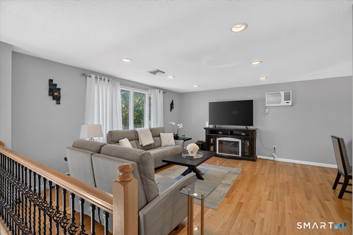 78 Sycamore Road South Windsor, CT 06074 - Photo 3 of 28 new hardwood flooring, fresh piant, recessed lighting and custom bannister