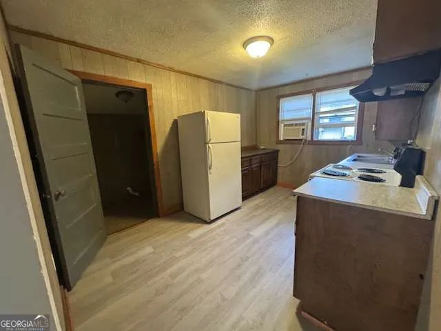 a kitchen with stainless steel appliances a refrigerator and a stove