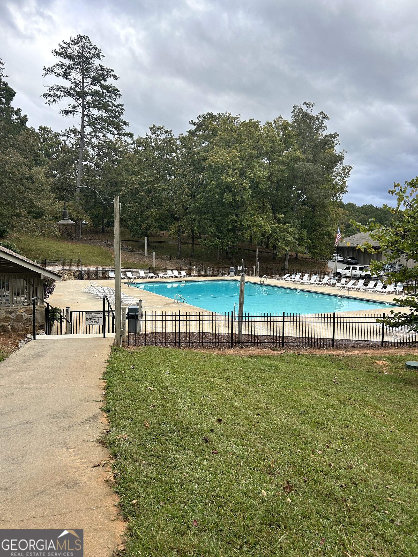 0 Lower Gap Road, Unit LOWR GAP Sautee Nacoochee, GA 30571 - Photo 7 of 14 a view of a swimming pool with an outdoor space and seating area