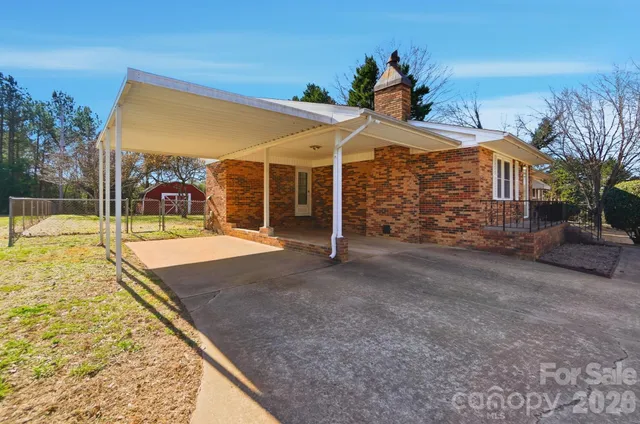 a view of a patio with a table and chairs