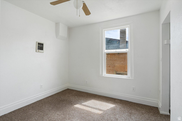 370 West 800 South Beaver, UT 84713 - Photo 9 of 15 Room featuring a single window, white walls, and brown carpet flooring