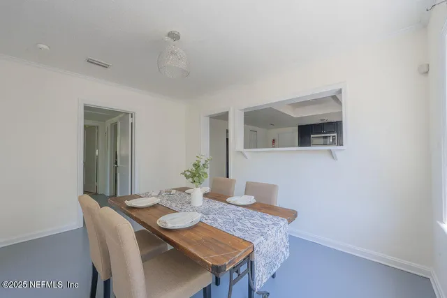 a spacious bedroom with a bed and a window