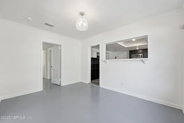 a bathroom with a toilet a sink and a window