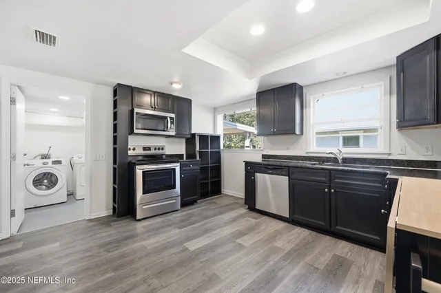 a reading room with furniture and a window