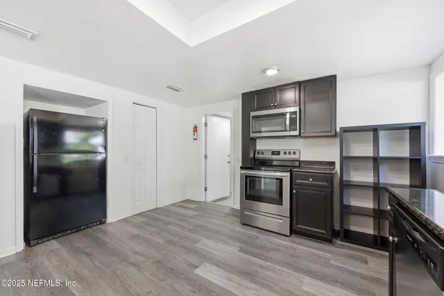 a view of a livingroom with furniture and a table