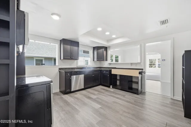 a bathroom with a toilet a sink and a mirror