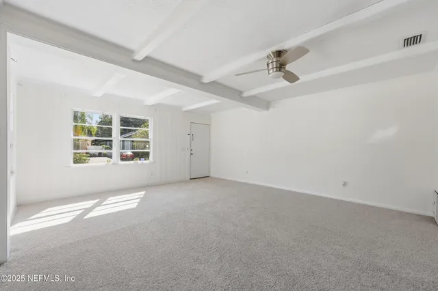 a kitchen with granite countertop stainless steel appliances and wooden cabinets
